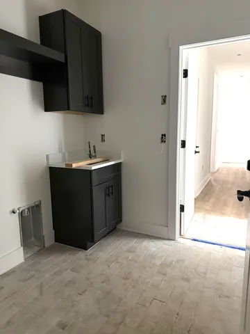 a view of a kitchen with a sink