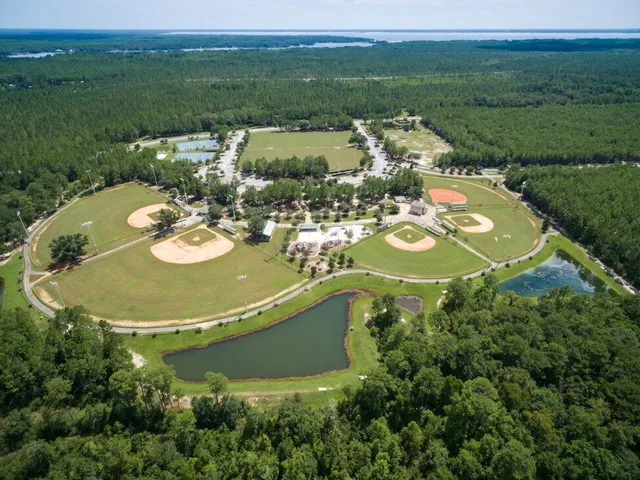 an aerial view of a house with outdoor space