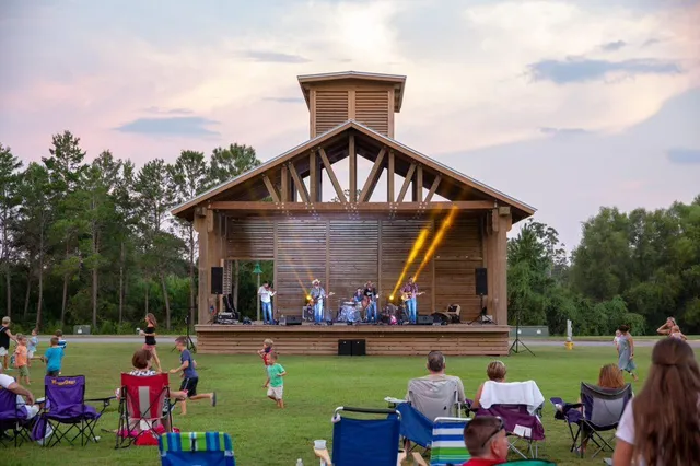 a view of a bench in the middle of a park