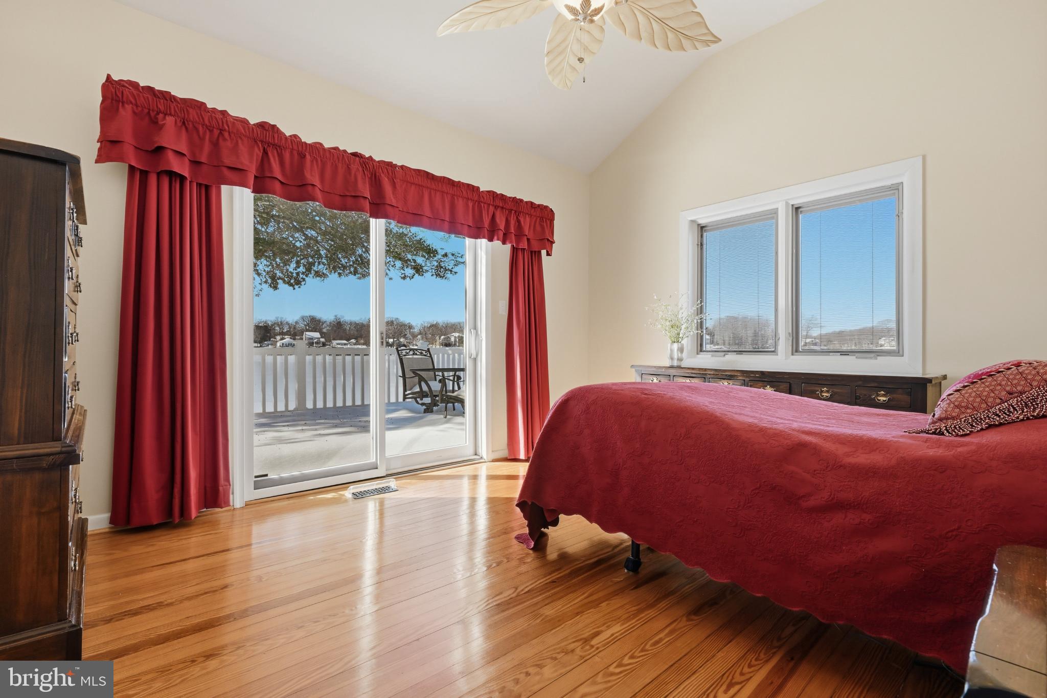 352 Riverside Drive Pasadena, MD 21122 - Photo 21 of 48 a bedroom with a bed and wooden floor