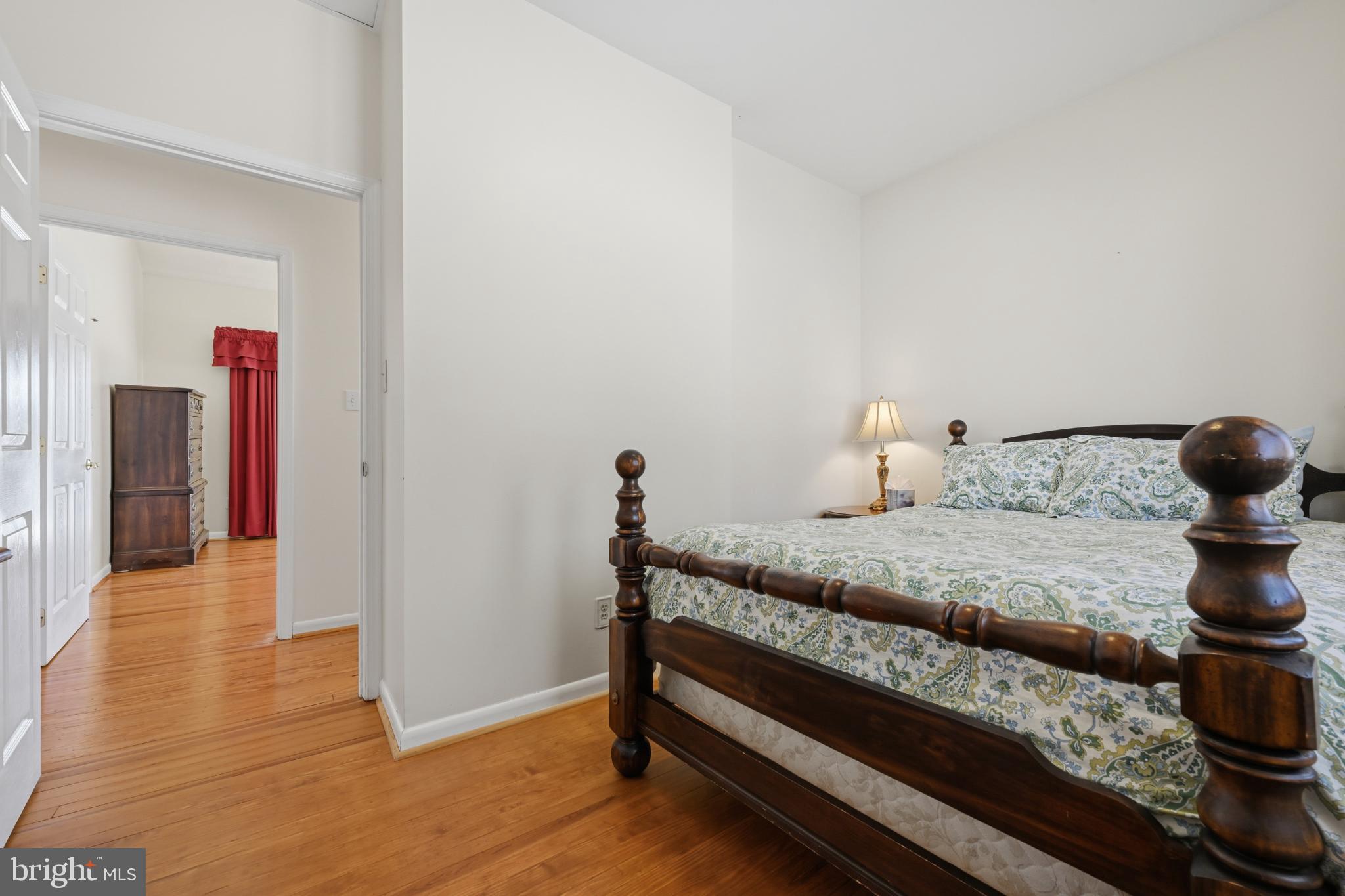 352 Riverside Drive Pasadena, MD 21122 - Photo 23 of 48 a bedroom with a bed and wooden floor
