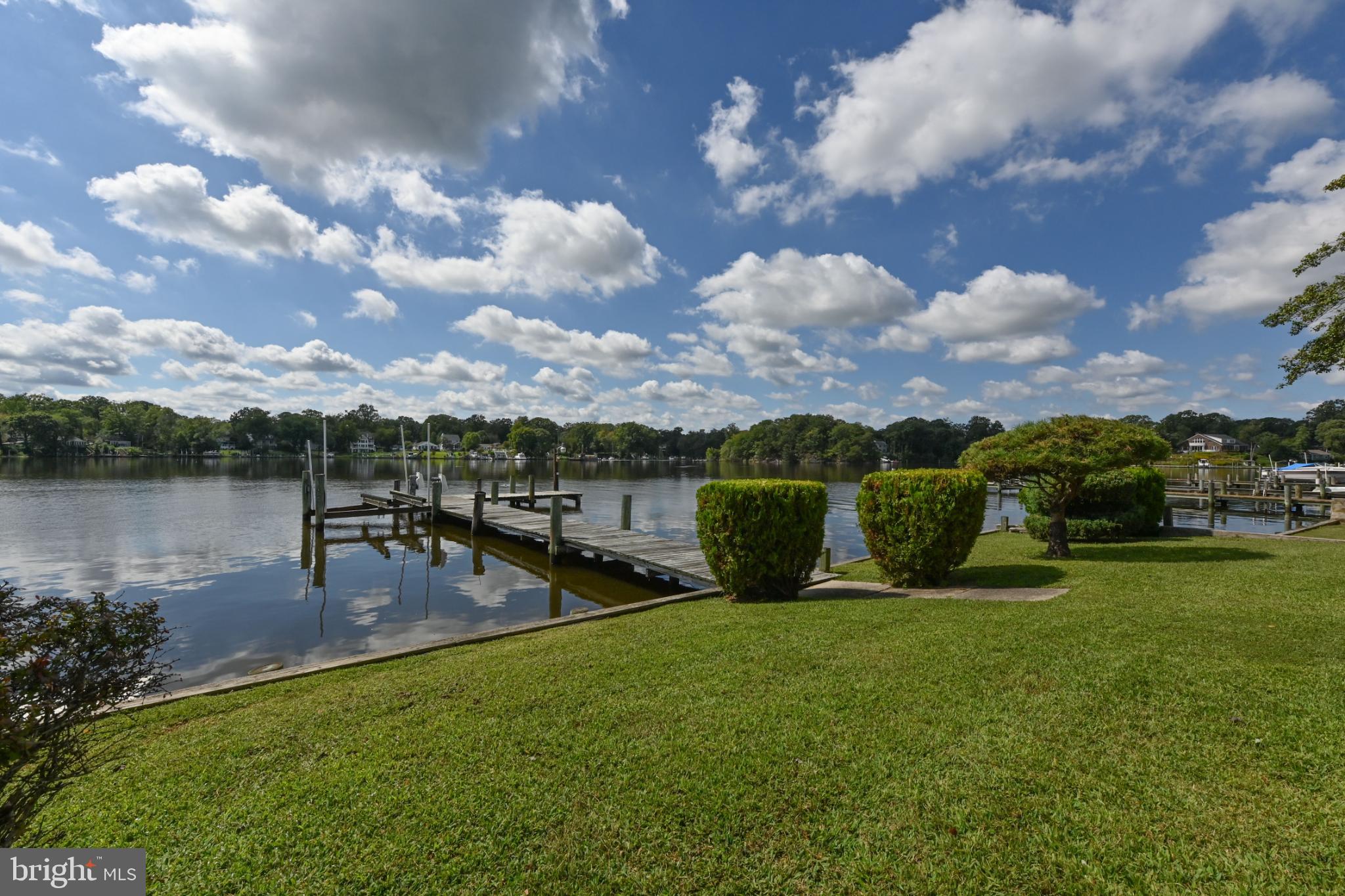 352 Riverside Drive Pasadena, MD 21122 - Photo 3 of 48 a view of a lake with a yard