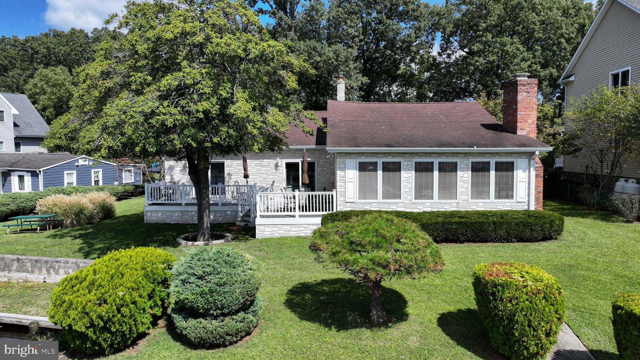 352 Riverside Drive Pasadena, MD 21122 - Photo 38 of 48 a house view with a garden space