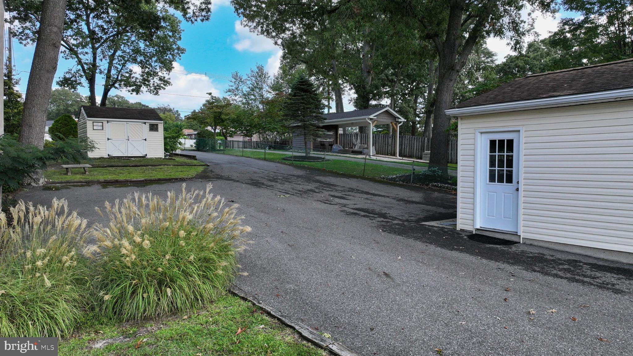 352 Riverside Drive Pasadena, MD 21122 - Photo 41 of 48 a view of a park that has large trees
