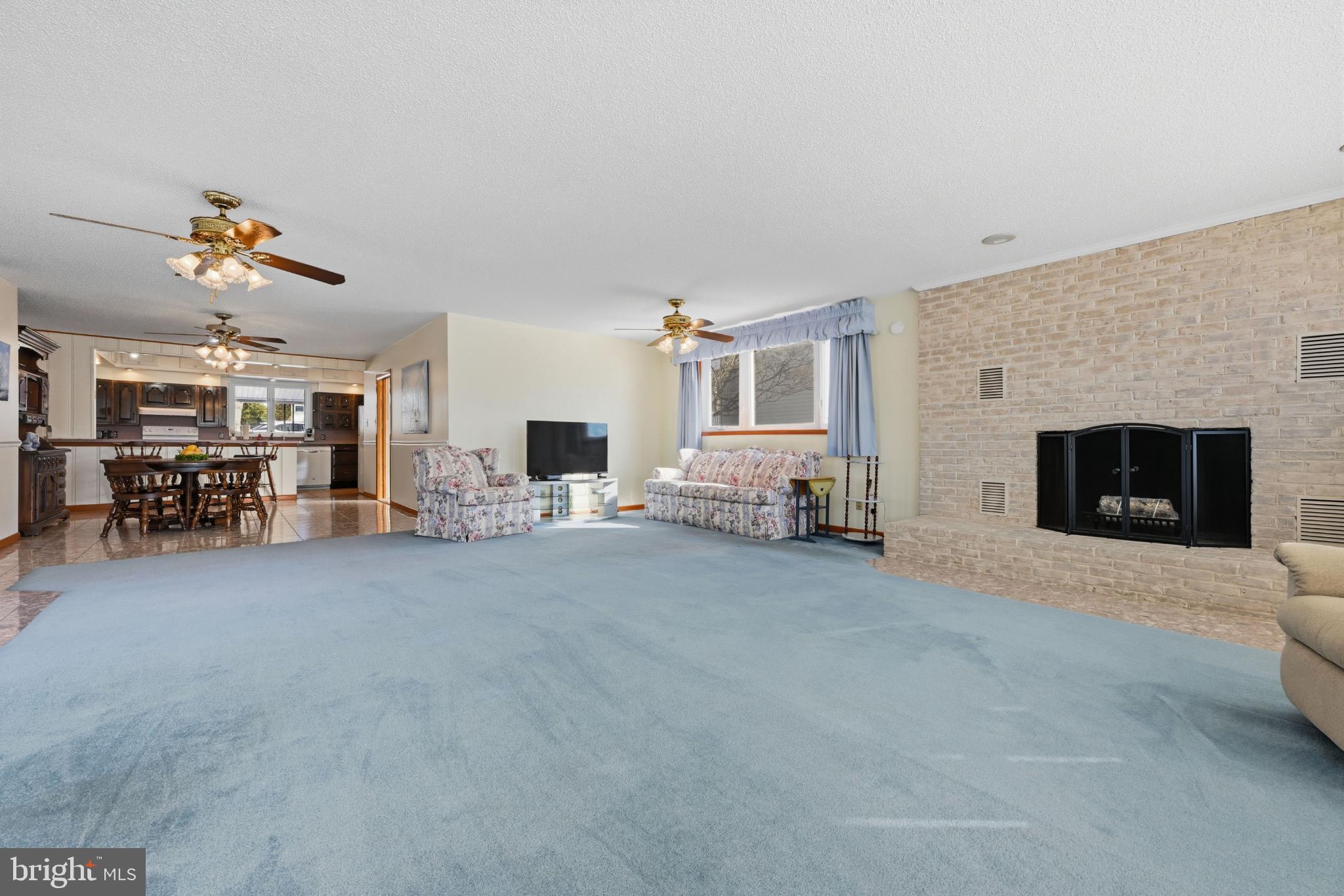 352 Riverside Drive Pasadena, MD 21122 - Photo 9 of 48 a living room with furniture and a fireplace
