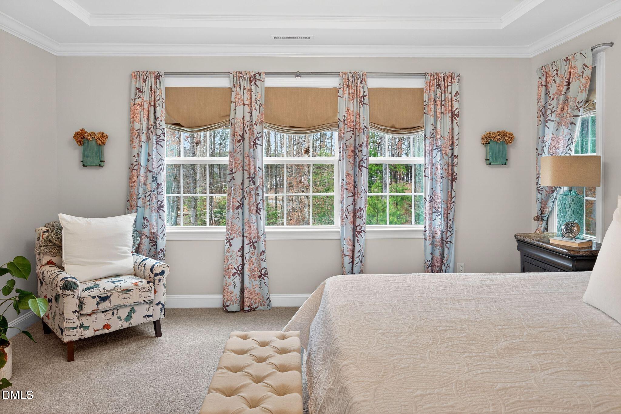 100 English Violet Lane Raleigh, NC 27610 - Photo 30 of 101 a bedroom with a bed couch and a window