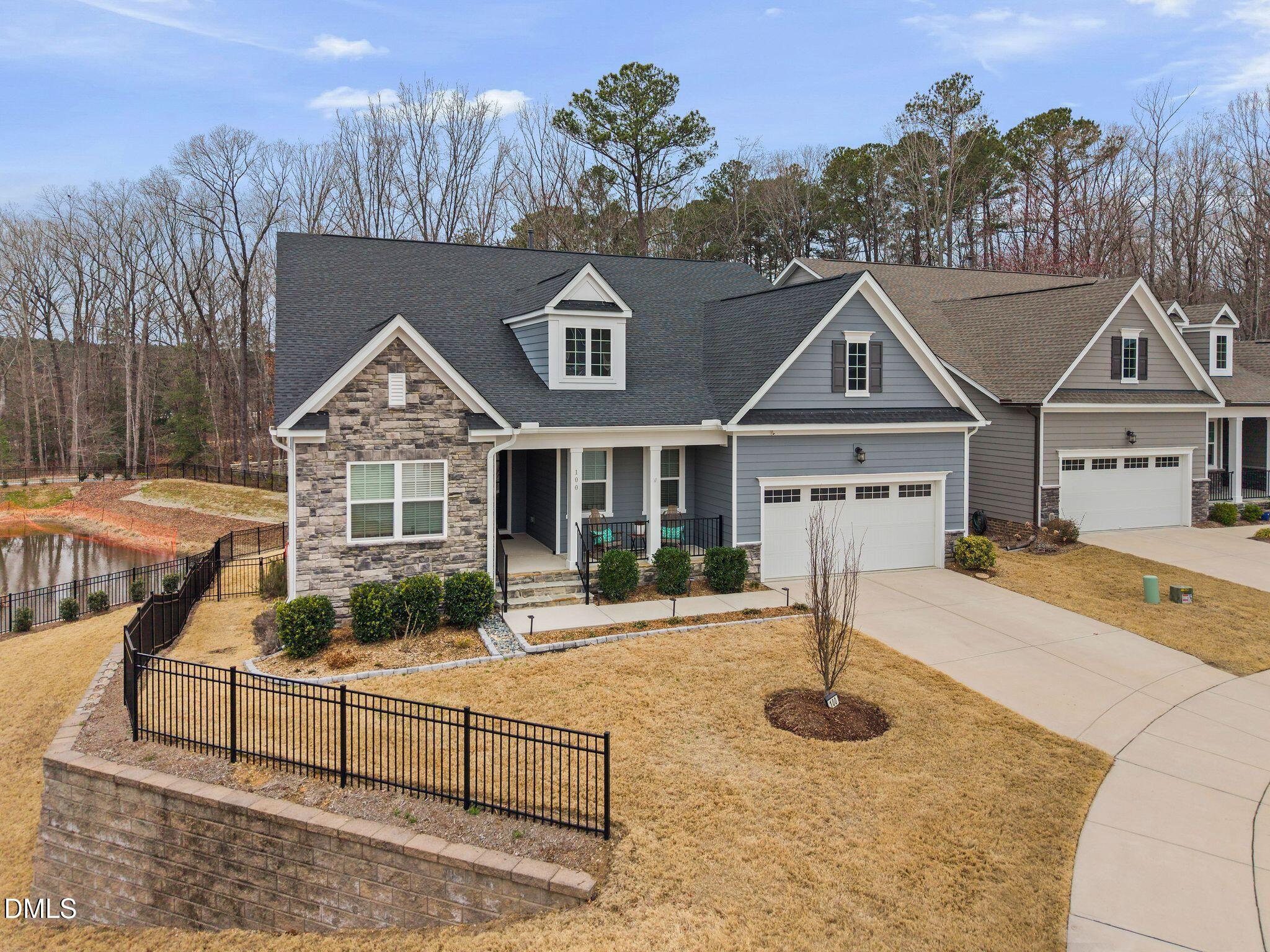 100 English Violet Lane Raleigh, NC 27610 - Photo 84 of 101 a front view of a house with swimming pool