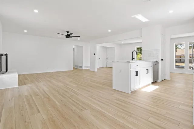 a view of kitchen and wooden floor