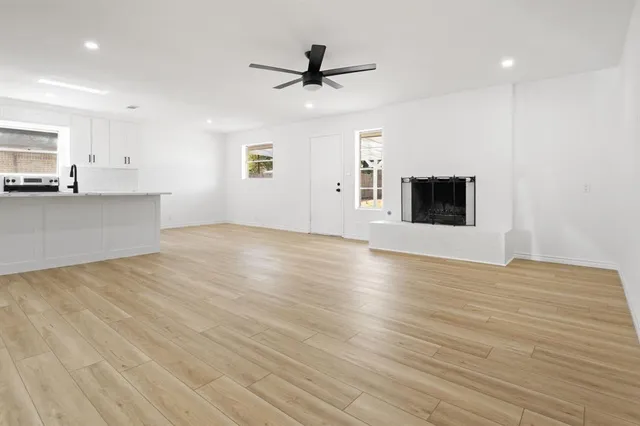 a view of a kitchen with microwave and cabinets