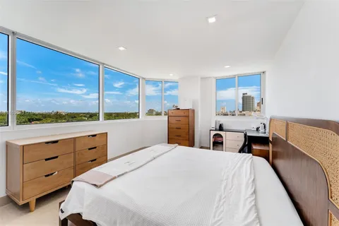 a bed room with a bed and a window