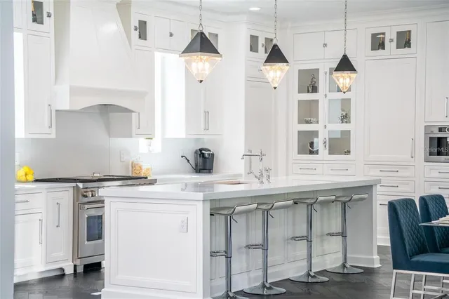 a large kitchen with stainless steel appliances kitchen island a large island in the center