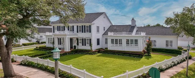 a view of a house with pool pool and chairs