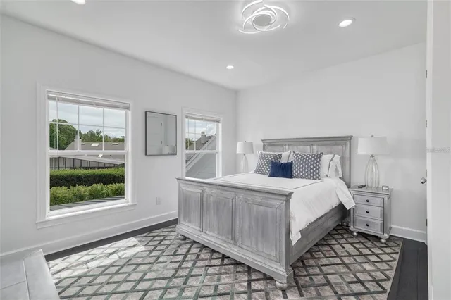 a bathroom with a double vanity sink mirror and shower