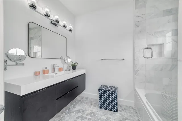 a bedroom with a large bed and a tv