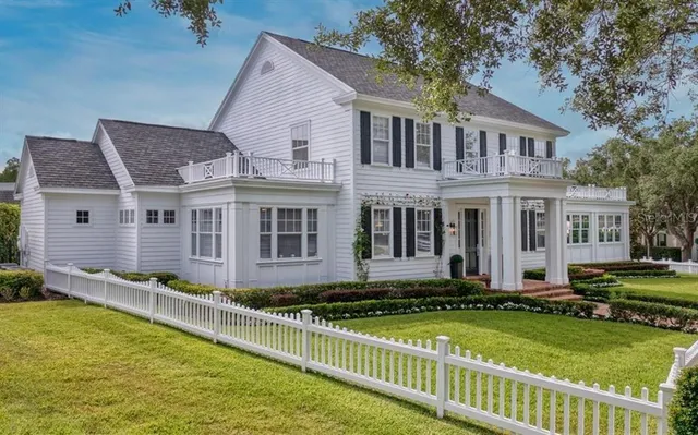 a front view of a house with a yard table and chairs