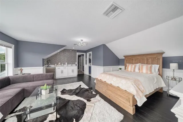 a front view of house with yard swimming pool and outdoor seating