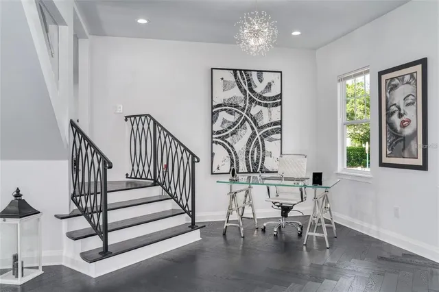 a view of entryway livingroom and hall with wooden floor