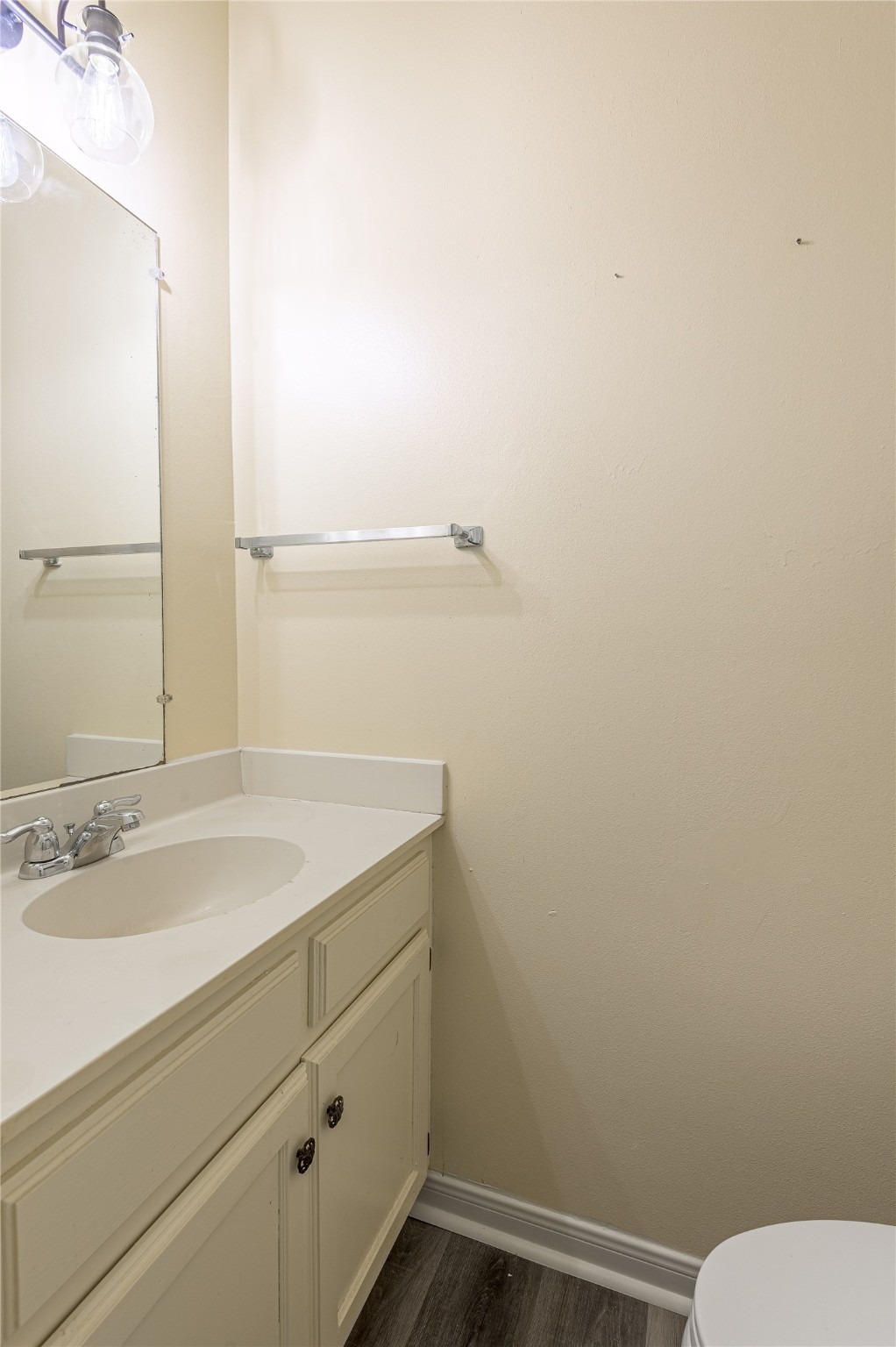 1401 Ave O, Unit F Huntsville, TX 77340 - Photo 13 of 26 a bathroom with a toilet and a sink