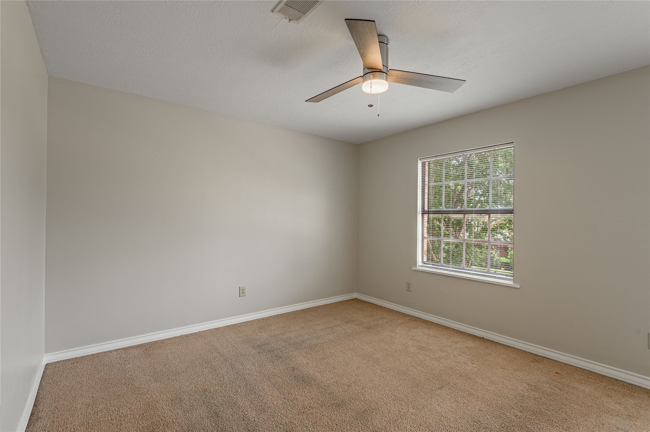1401 Ave O, Unit F Huntsville, TX 77340 - Photo 14 of 26 an empty room with a window