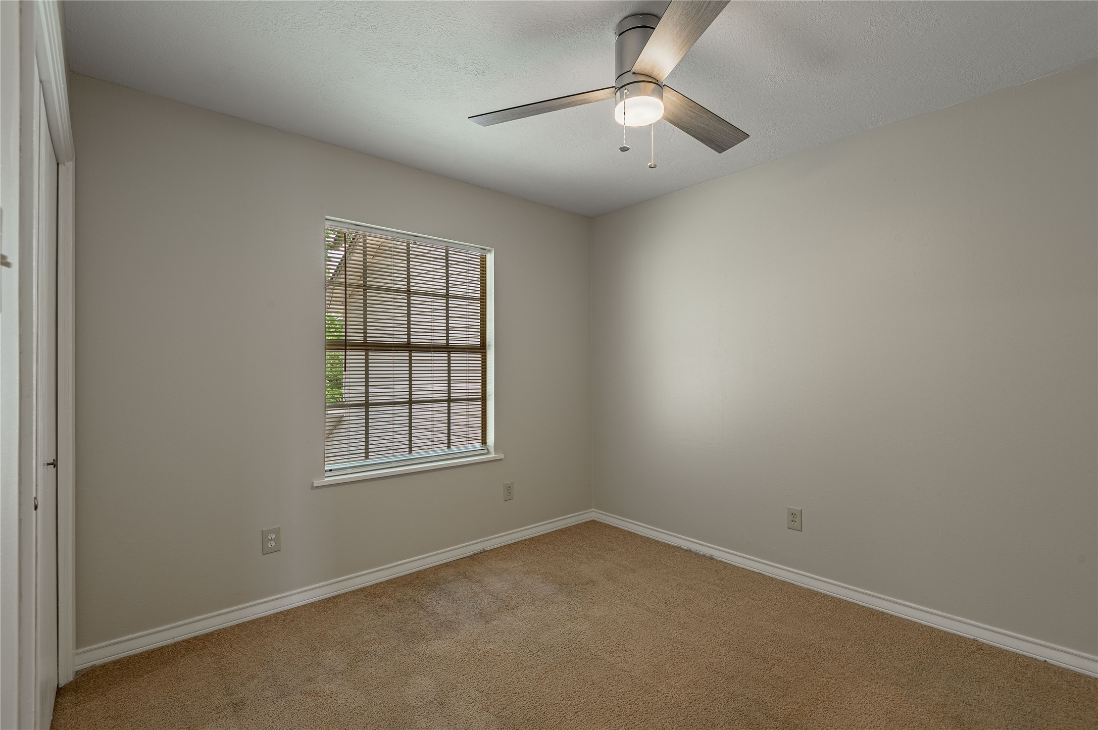1401 Ave O, Unit F Huntsville, TX 77340 - Photo 18 of 26 an empty room with a window