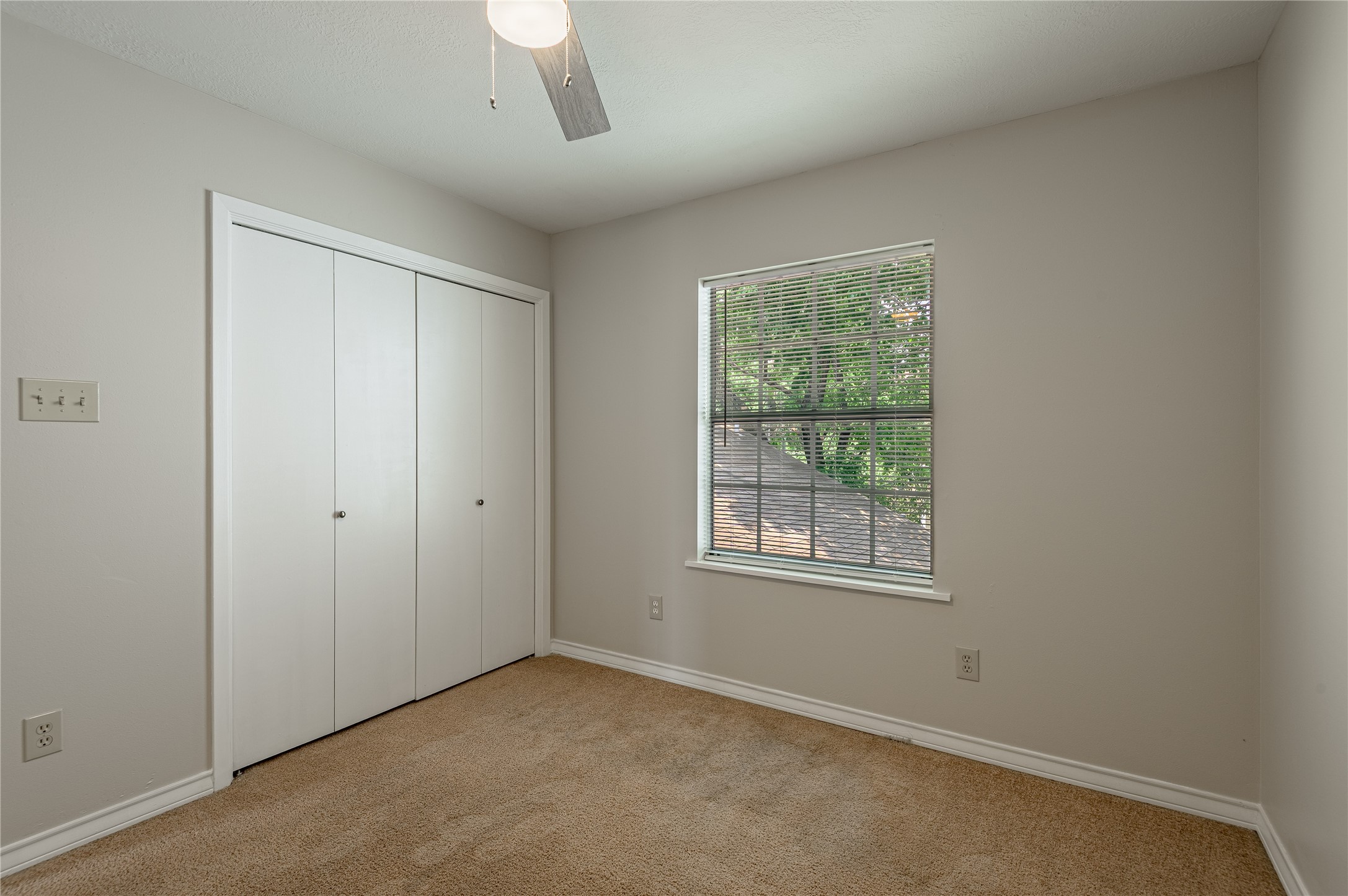 1401 Ave O, Unit F Huntsville, TX 77340 - Photo 19 of 26 an empty room with windows