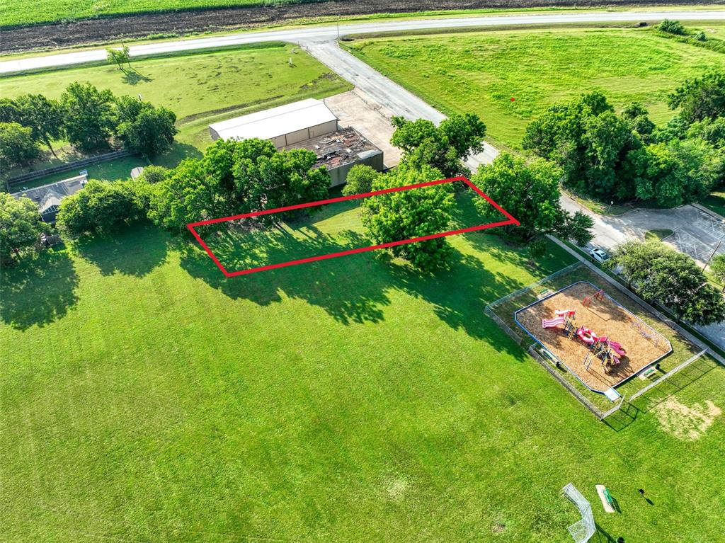 723 East Main Street Lancaster, TX 75146 - Photo 5 of 11 a view of a field with plants and large trees