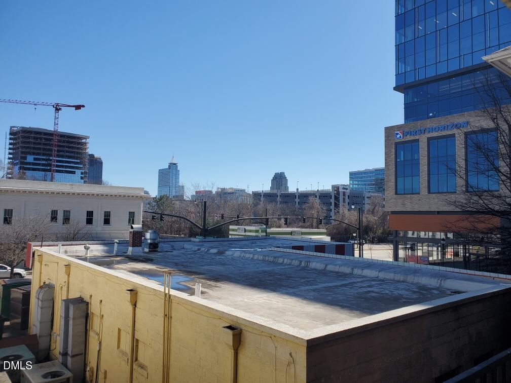 610 Hillsborough Street, Unit 205 Raleigh, NC 27603 - Photo 14 of 15 a view of a kitchen with a sink and cabinets