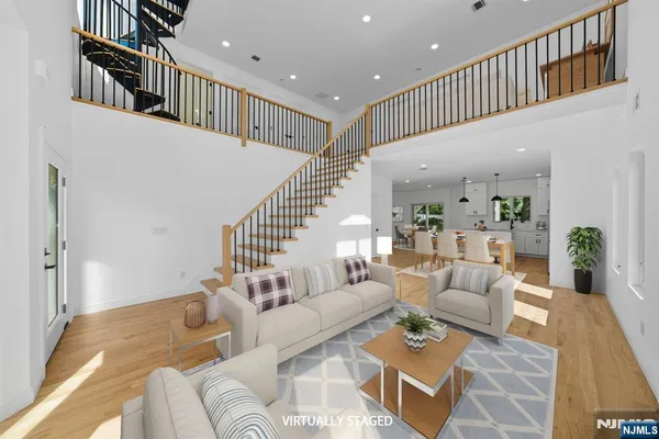 a living room with furniture and stairs
