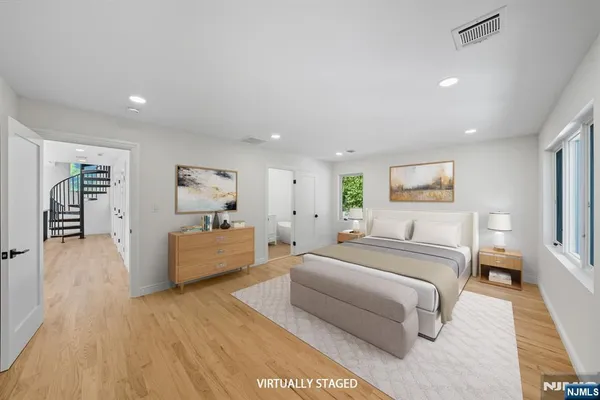 a bedroom with a large bed and a couch