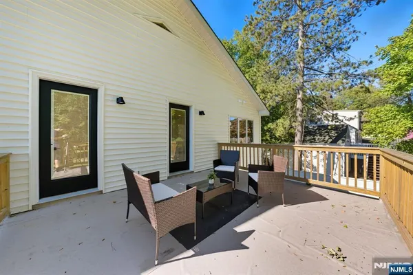 a view of an entryway with wooden floor