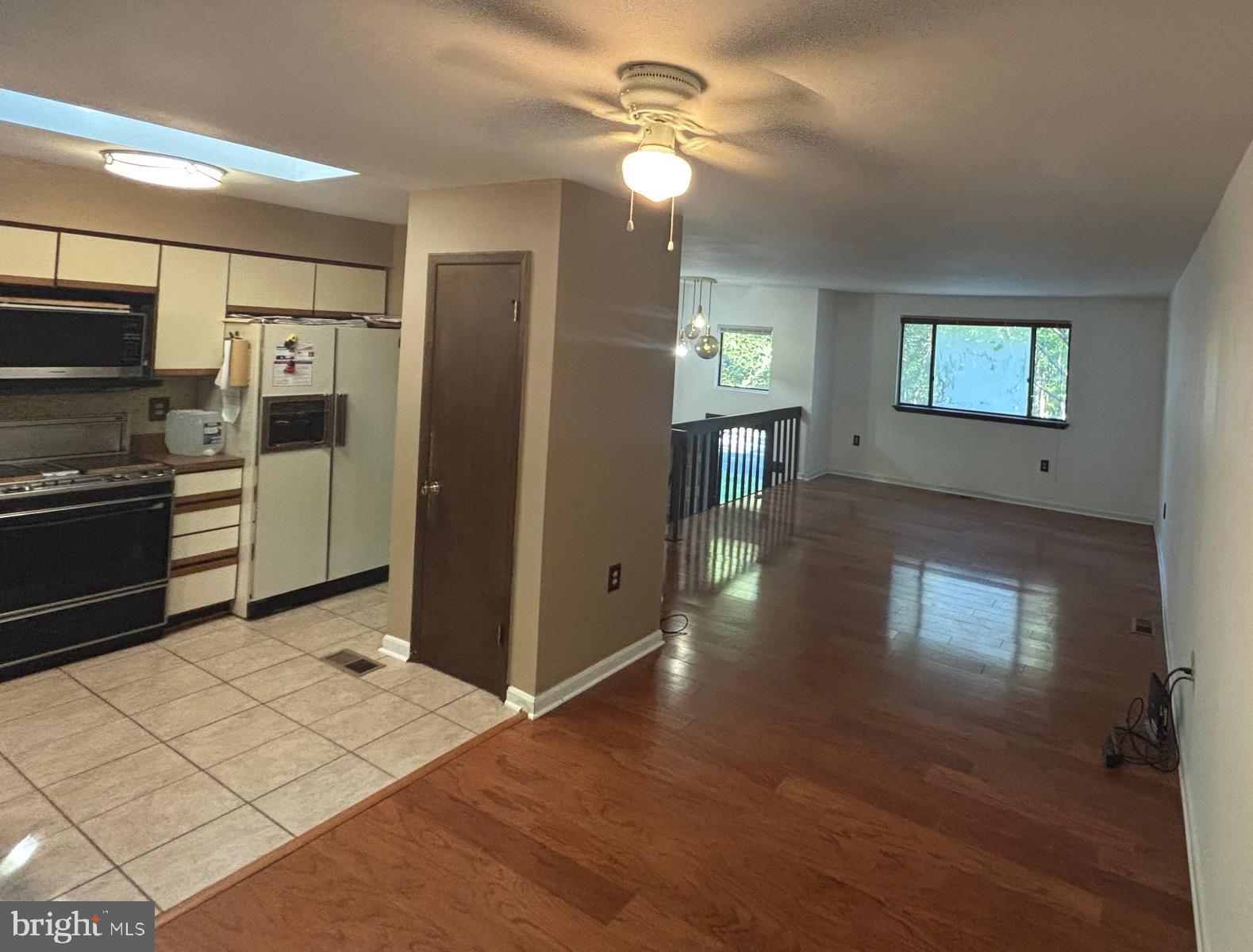 3160 Rolling Road Edgewater, MD 21037 - Photo 10 of 62 a view of a kitchen with wooden floor electronic appliances and a window