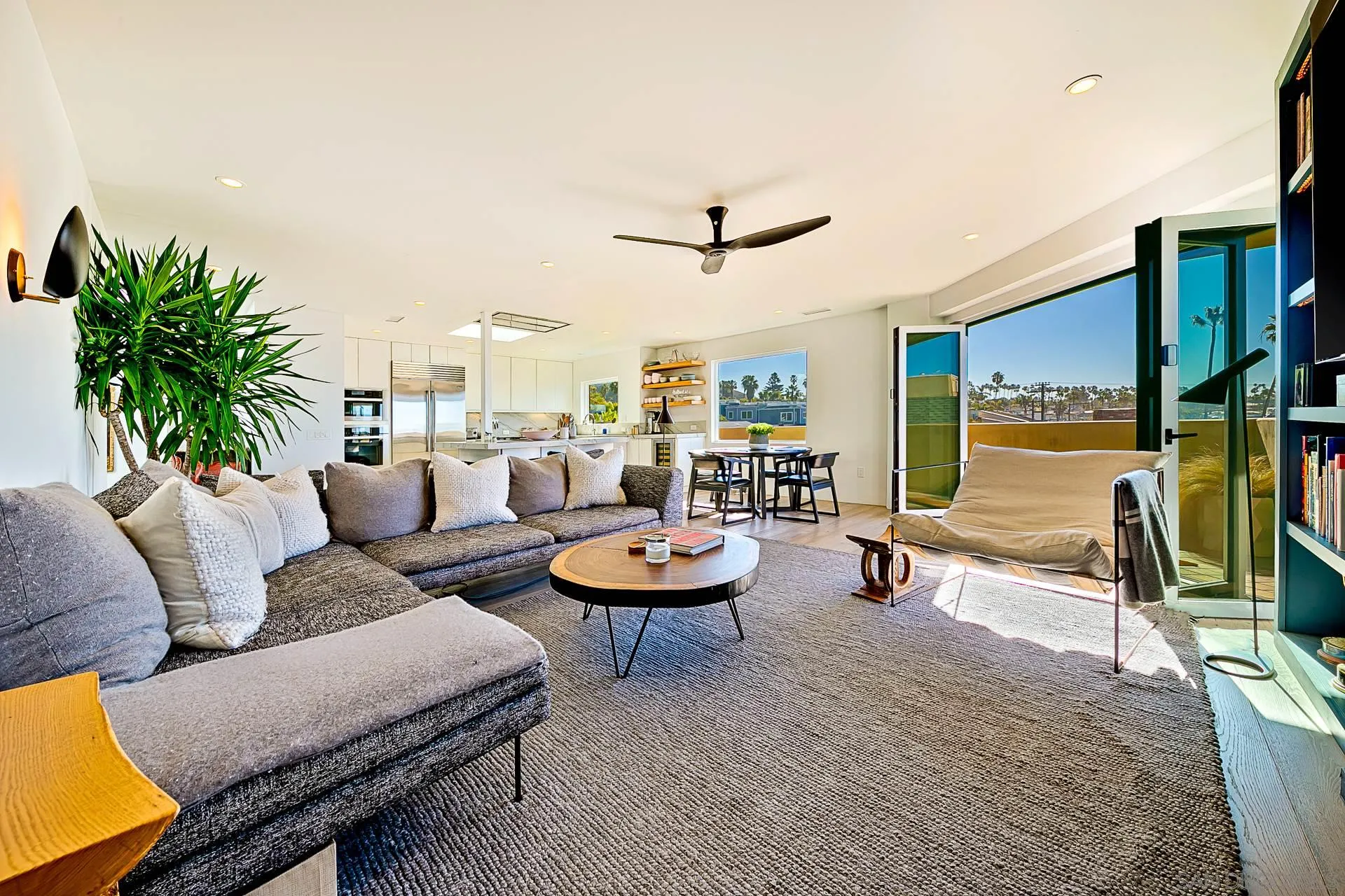231 Bonair Street La Jolla, CA 92037 - Photo 22 of 44 a living room with furniture and a flat screen tv