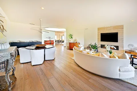 a living room with furniture and a flat screen tv