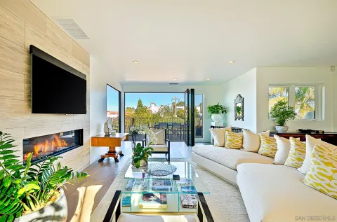 a living room with furniture fireplace and a flat screen tv
