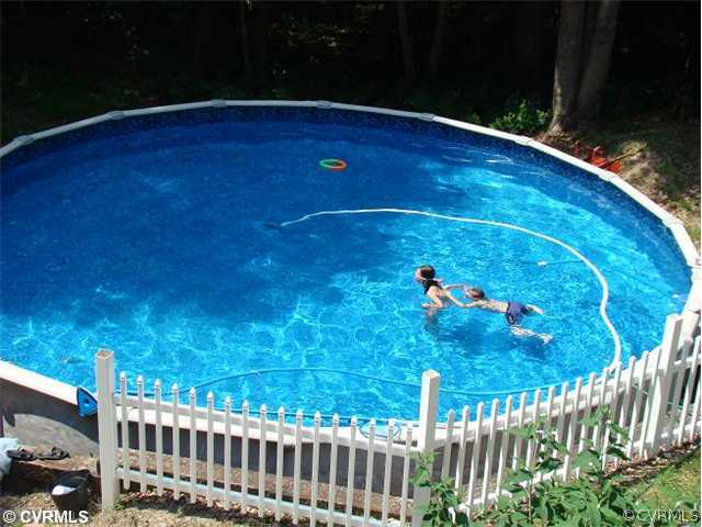 912 Rasmussen Drive Sandston, VA 23150 - Photo 4 of 12 Exterior Back - New Huge Above Ground Pool thats g