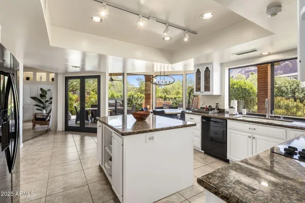 a kitchen with a sink and large window