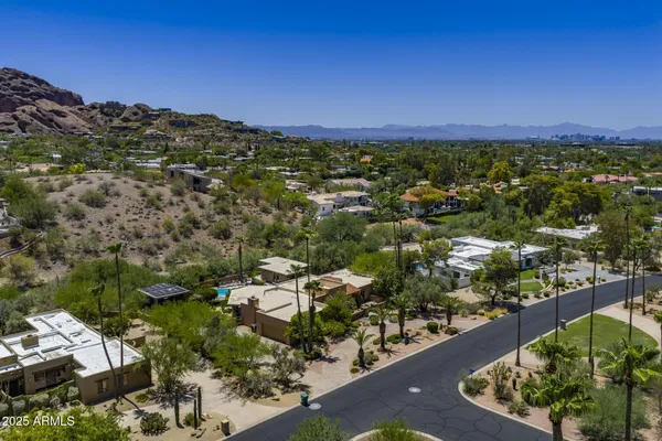 an aerial view of residential houses with outdoor space