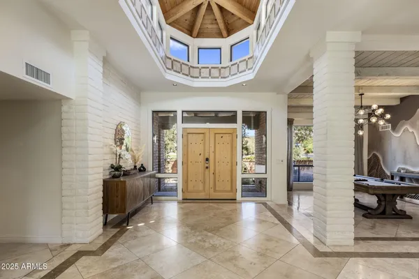 a view of an entryway with a workspace