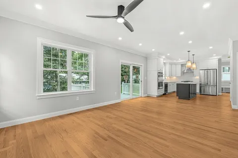 a view of a kitchen with a sink and a window
