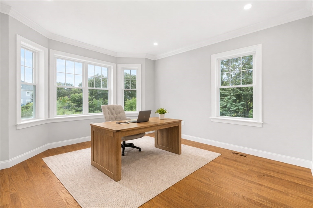 26 Flagg Street Woburn, MA 01801 - Photo 19 of 39 a view of a workspace with wooden floor and a window