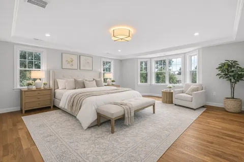 a bedroom with a large bed and a couch