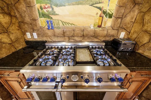 a view of an empty room with furniture and storage