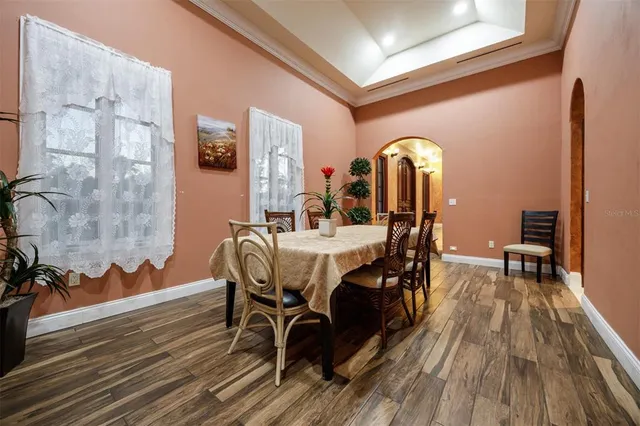 a bathroom with a granite countertop toilet sink and mirror