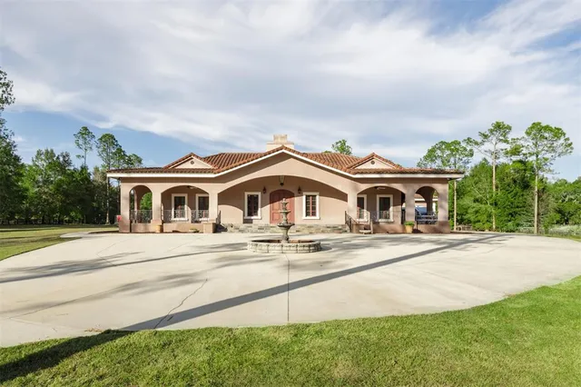 a bathroom with a glass shower door and a mirror