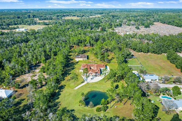 a bedroom with a bed couch and a window