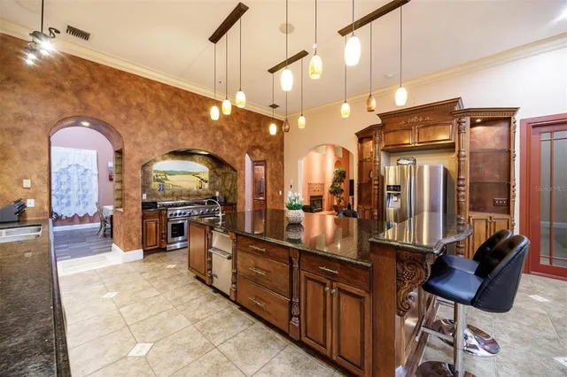 a bathroom with a granite countertop toilet sink and mirror