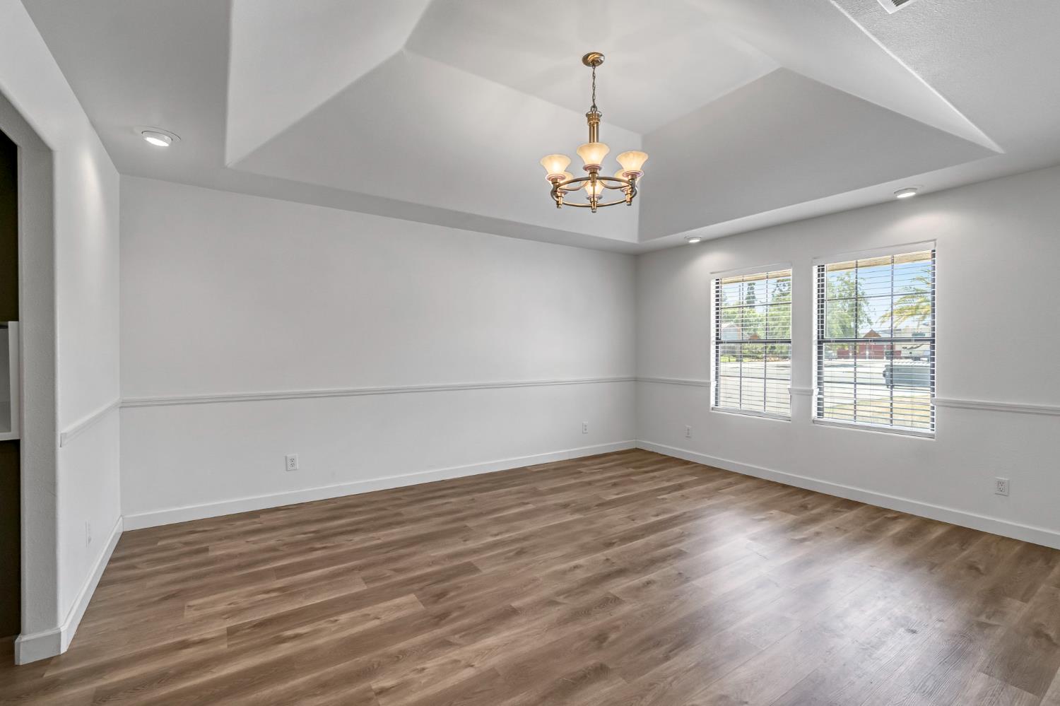 36065 Manon Avenue Madera, CA 93636 - Photo 15 of 50 wooden floor in an empty room with a window