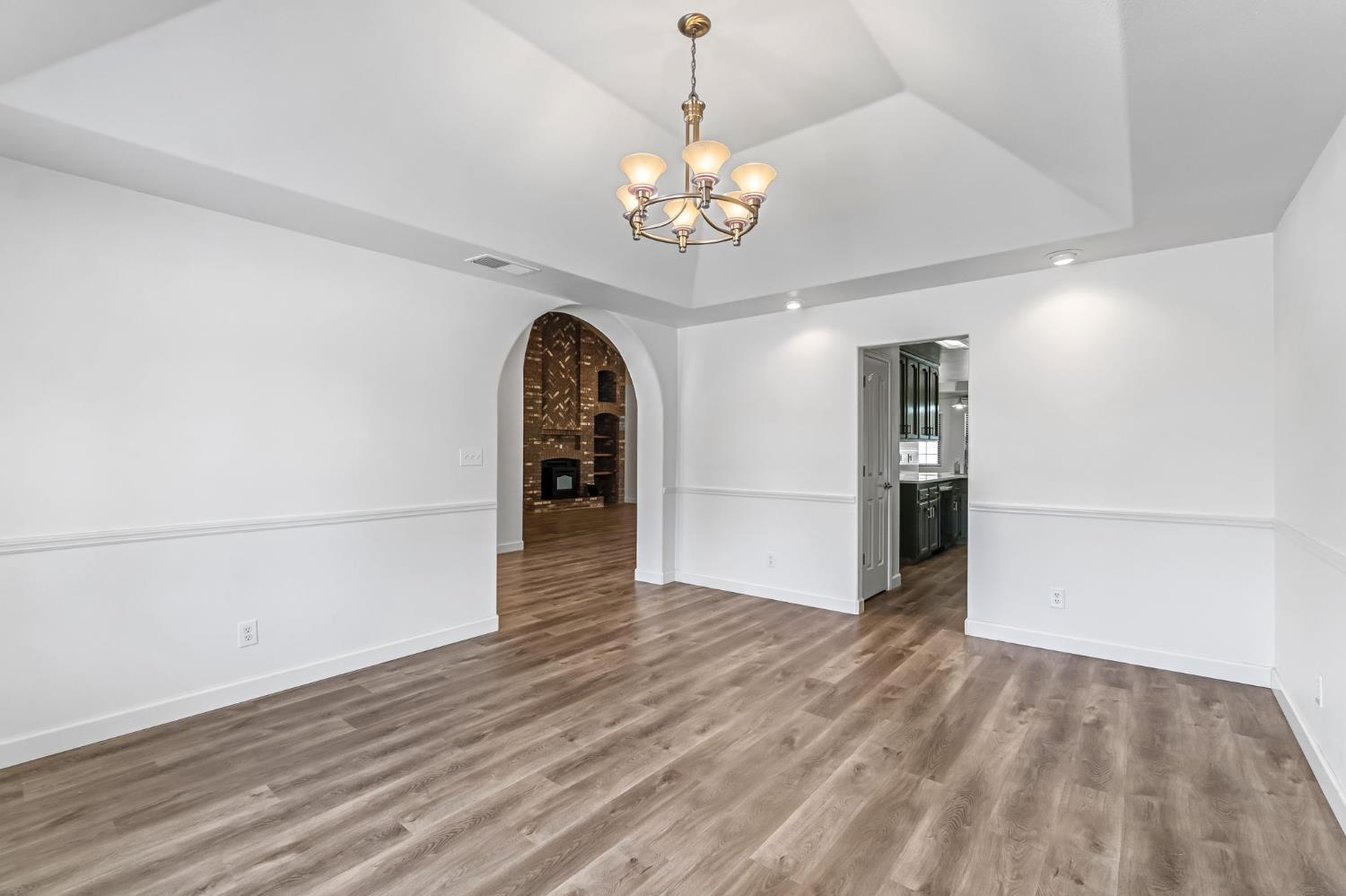 36065 Manon Avenue Madera, CA 93636 - Photo 16 of 50 wooden floor in an empty room with a window