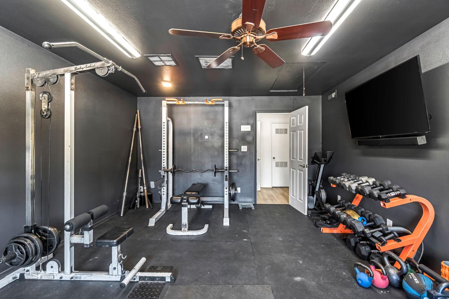 36065 Manon Avenue Madera, CA 93636 - Photo 21 of 50 a living room with furniture and a flat screen tv
