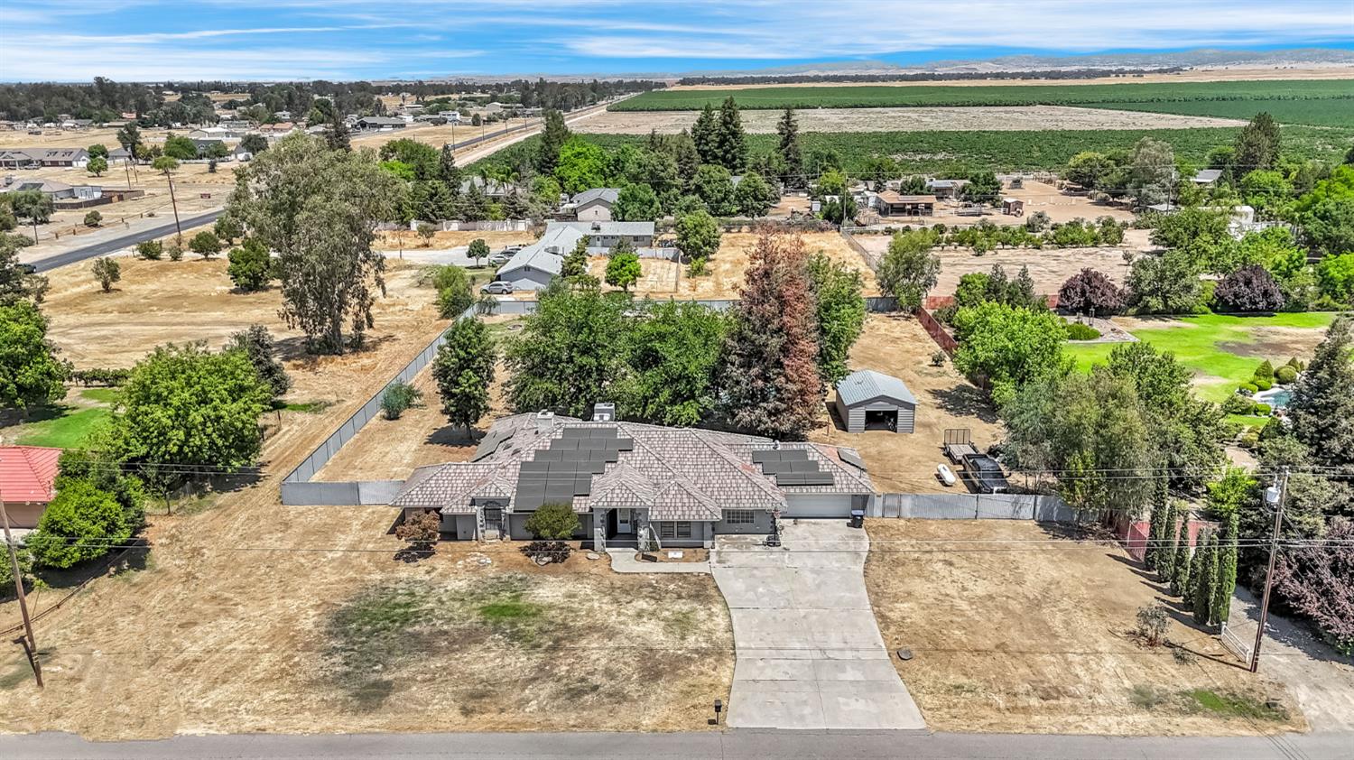 36065 Manon Avenue Madera, CA 93636 - Photo 43 of 50 an aerial view of residential houses with outdoor space